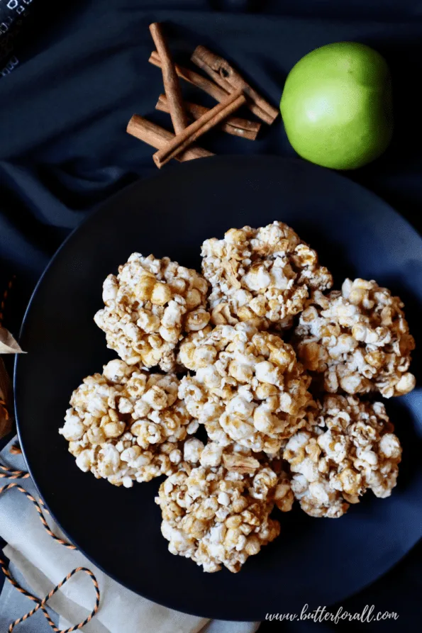 Plate of seven Cinnamon Apple Honey-Butter Caramel Popcorn Balls.