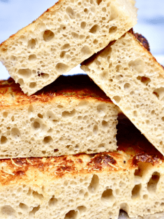 A stack of cut Focaccia show the open crumb structure.