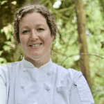 Courtney Queen, author and chef of Butter For ALL, head shot in chef coat.