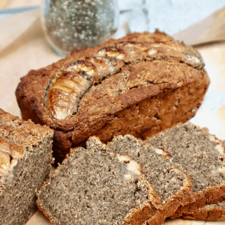 Freshly baked and sliced buckwheat banana bread with a jar of chia seeds.