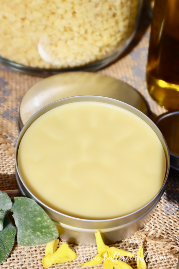 A 4-ounce tin with solid golden salve.