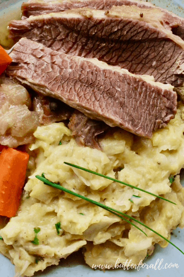 Juicy slices of corned beef served with colcannon, cabbage. and carrots.