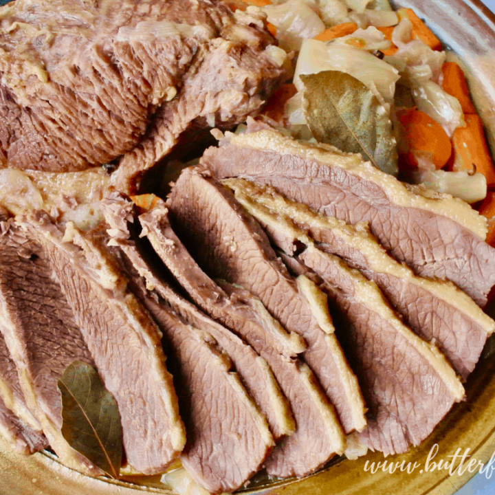 A large platter with freshly cooked and sliced homemade corned beef.