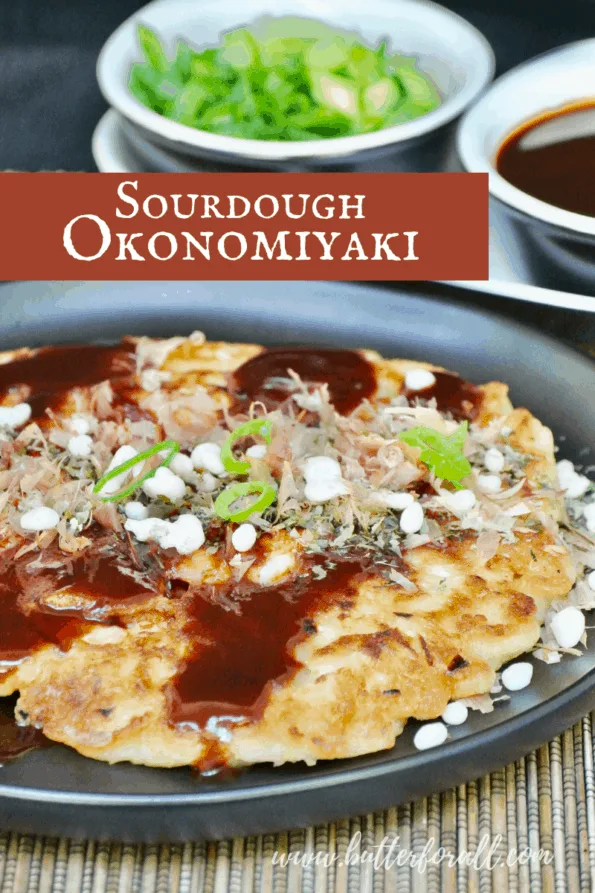 Golden brown okonomiyaki pancake with toppings and text overlay.