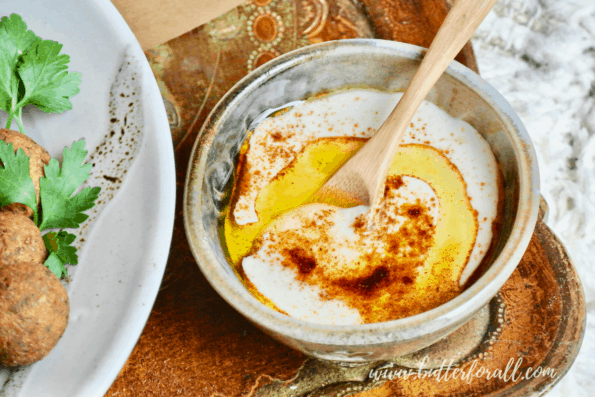 Tahini dressing with falafel balls.