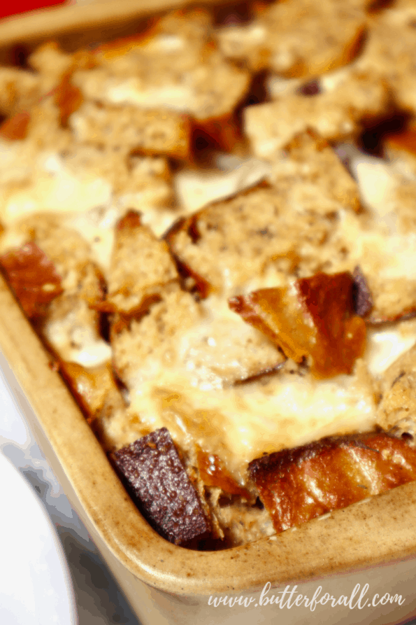 Golden brown melted cheese tops this savory bread pudding.