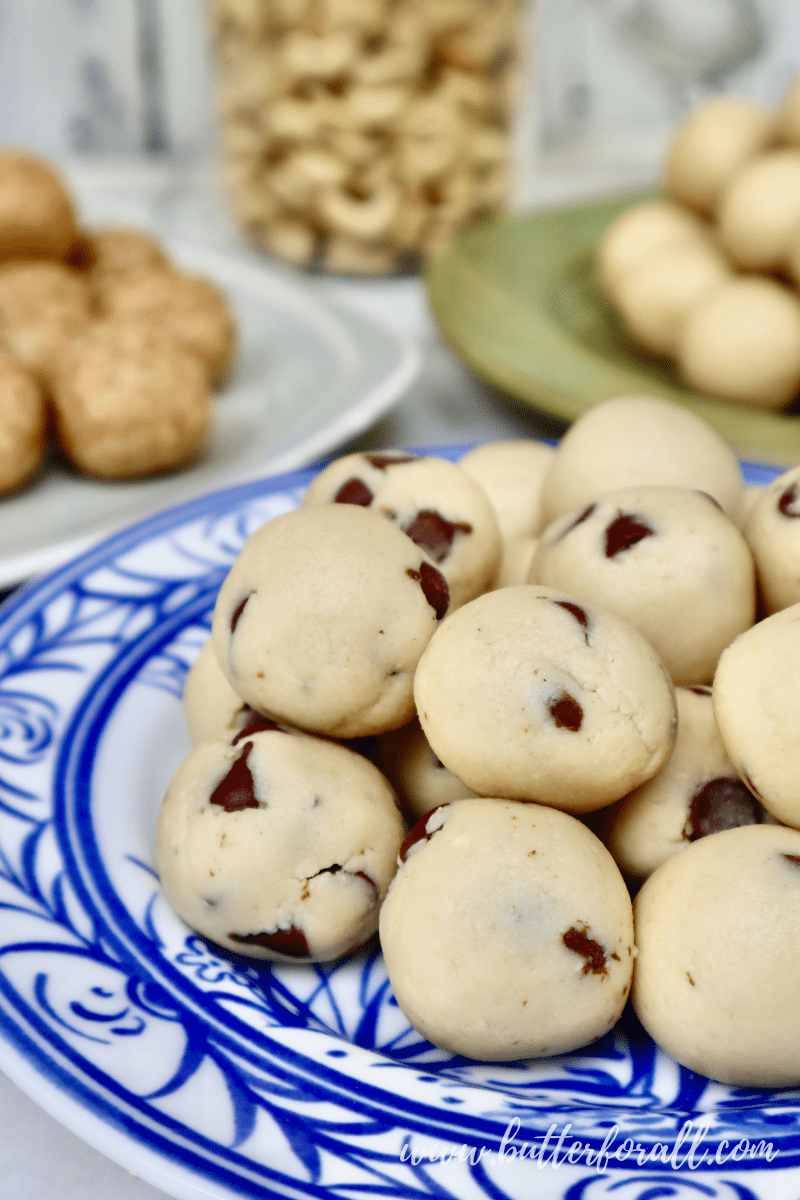 Close-up of a plate of chocolate chip cashew cookie dough bites.