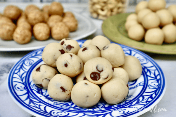 Colorful plates filled with cashew cookie dough bites in a variety of flavors. 