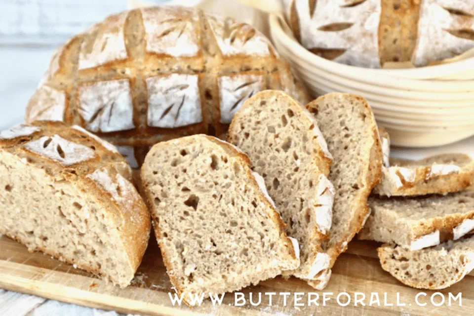 Slices of seven-grain sourdough bread showing the open even crumb and golden crust. 