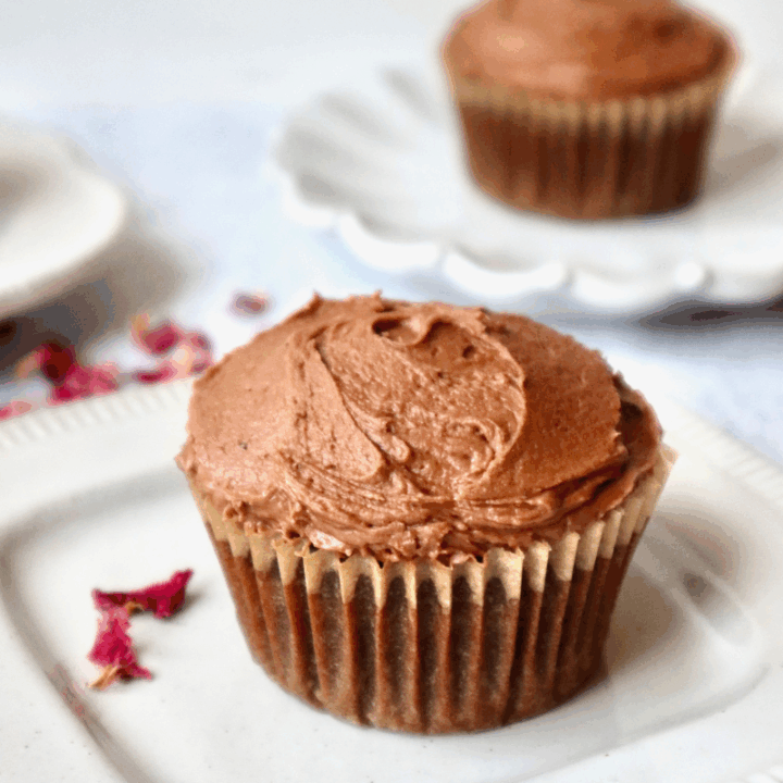 A close-up of a chocolate frosted cupcake.